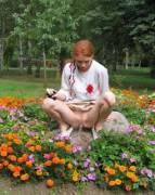 panties in her hand, pausing for a pee in the flowers on her way home