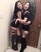 Pair of sexy booted Asians