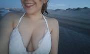Saggy cleavage on a beach