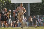 Beefy straight guy with farmer's tan streaking on the rugby field