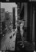 Naked on the balcony at the Chelsea Hotel