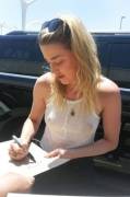 Amber Heard pokies in a white tank top