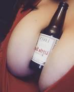 Bodacious boobs holding a beer