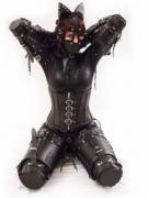 Slavegirl head to toe in leather and latex