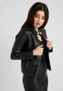 Brunette in leather jacket and pants
