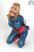 Stacy Burke - Blue Latex Catsuit, Black Harness and Ballgag