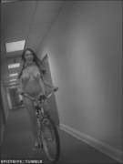 riding a bike down a hallway