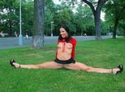 Doing the splits in a park, showing it all