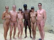 Group of nudist friends posing for the photo