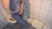 Wetting her jeans by the toilet