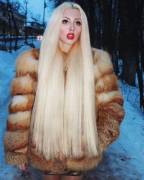 Long haired blonde in fox fur....