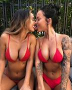 Kissing in red bikinis