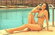 Pre-Wonder Woman, 20-year-old, bikini-clad Lynda Carter relaxes poolside (circa 1971-1972)