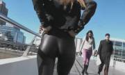 She teases her nice ass and cameltoe in public while people are walking by