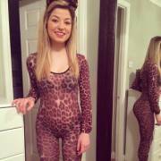 Cutie in a full body leopard print catsuit and ears.