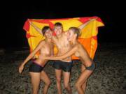 Three on a beach at night