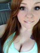 Red hair, freckles, lip bite and lots of cleavage