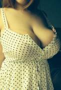 big breasted beauty in a polka dot dress