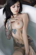 Wearing nothing but her tattoos and a choker. [x-post /r/BathtubBeauties]