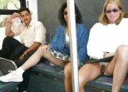 A couple of girls spreading on the bus