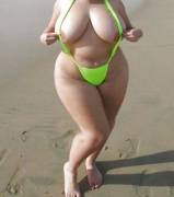 Curvy girl with big hips on the beach