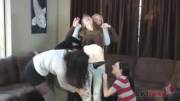 Girl held by friends while they take off her clothes