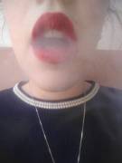 Red lipstick and cigarette smoke?