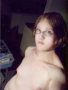 Tiny-titted amateur with glasses is annoyed to be nude.