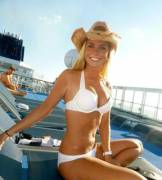 blonde w/cowboy (or straw?) hat on a cruise ship