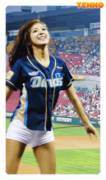 Korean girl dancing at a baseball game. That smile!!!