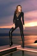Miranda Kerr in tight black outfit with long boots