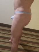 Hanging out in the hotel in just a thong