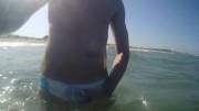 Rubbing bulge at the beach