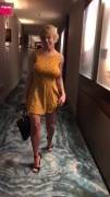 Busty blonde removes dress in hotel hallway [gif]