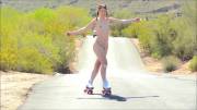 Aurora Belle roller skating on the road [gif]
