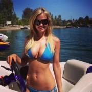 Busty blonde bikini boat babe