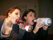 Drunken duo fellate liquor bottles for attention
