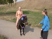 Olga T riding a pony in Ryazan, Kremlin - Russia