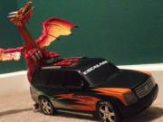 Dragon having fun with new car