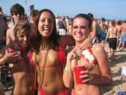 Naughty beach girls expose their titties