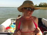 Slut on a boat flashing her tits