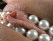 Mesmerizing GIF of pearls being slid around girl's clit