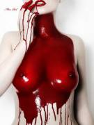 Topless girl covered in red gloss