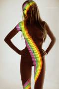 Naked blonde covered in rainbow light