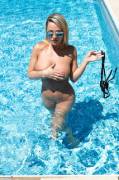 Nikki Sims in black bikini with silver polkadots