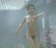 Chinese Beauty Frollicks Nude in a Garden