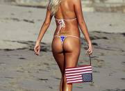 Tiny bikini bottoms are all she needs to show those American cheeks.