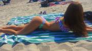 Stretching out on beach towel