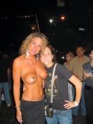 Older woman topless at a festival (x-post from /r/olderwoman/)