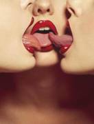 Three hot women, red lipstick, tongues touching